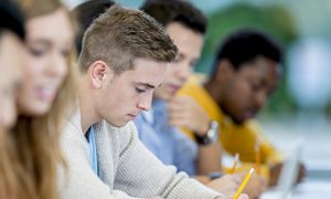 Students working at desk doing research