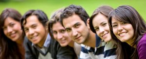 Wonkhe image header. Image of six students sitting forwards and smiling.
