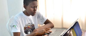 Student using a laptop computer at home during COVID