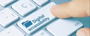 Finger pointing at a key on a keyboard. The key reads "Digital accessibility"